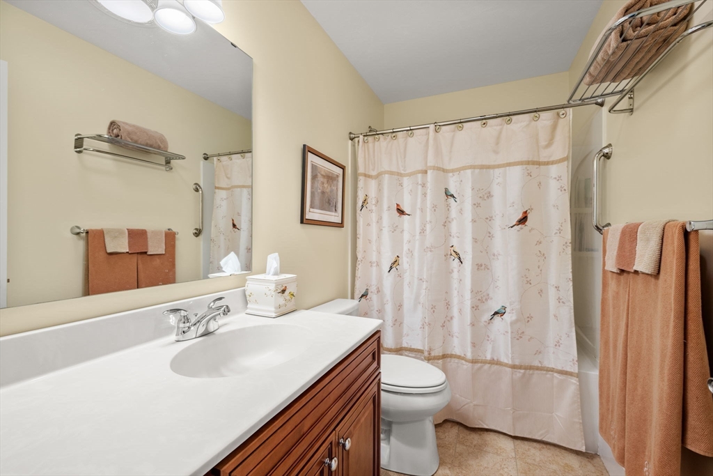 96 Walden Way, Unit 52 Milford, MA 01757 - Photo 19 of 23 a bathroom with a sink toilet and shower