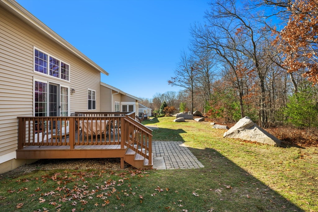 96 Walden Way, Unit 52 Milford, MA 01757 - Photo 21 of 23 a view of a deck with a yard