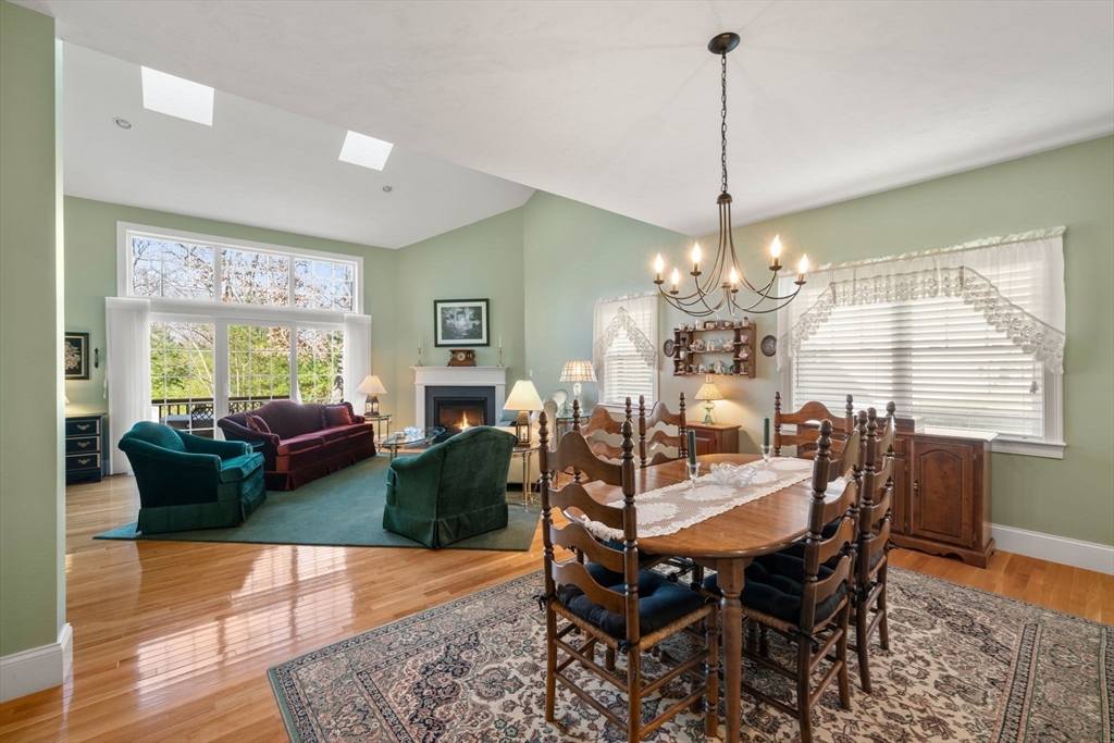 96 Walden Way, Unit 52 Milford, MA 01757 - Photo 6 of 23 a view of a dining room with furniture window and wooden floor