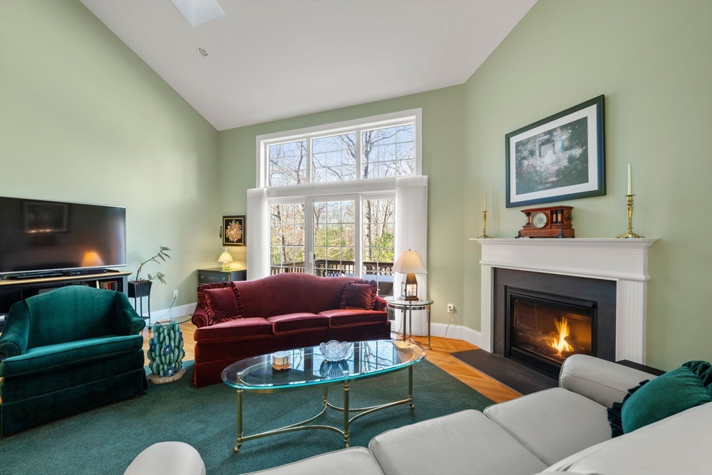 96 Walden Way, Unit 52 Milford, MA 01757 - Photo 8 of 23 a living room with furniture and a fireplace