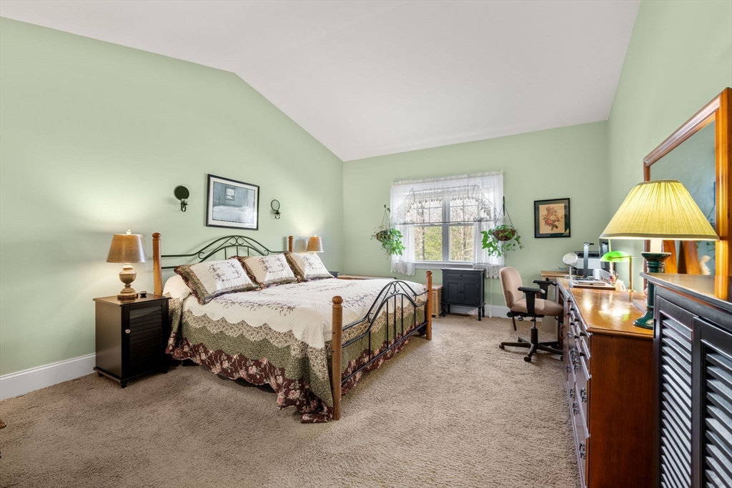 96 Walden Way, Unit 52 Milford, MA 01757 - Photo 9 of 23 a spacious bedroom with a bed and a table