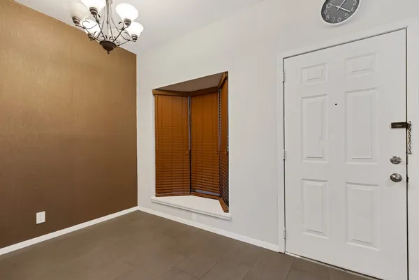 a view of a chandelier in an empty room