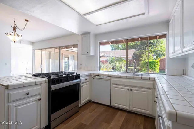 a kitchen with a stove and a sink