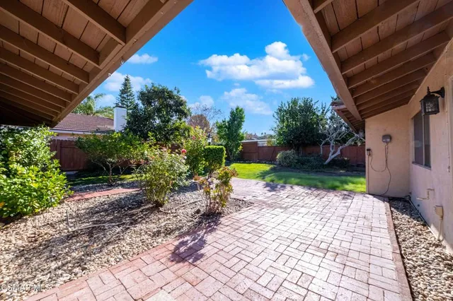 a view of a backyard with garden