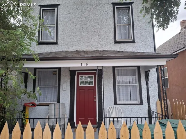 a front view of a house with a porch