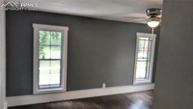 a bathroom with a granite countertop sink a toilet and a mirror