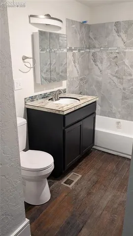 a house with trees in the background