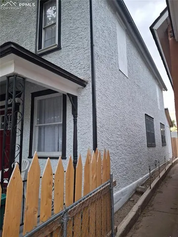 a kitchen with a refrigerator and a sink
