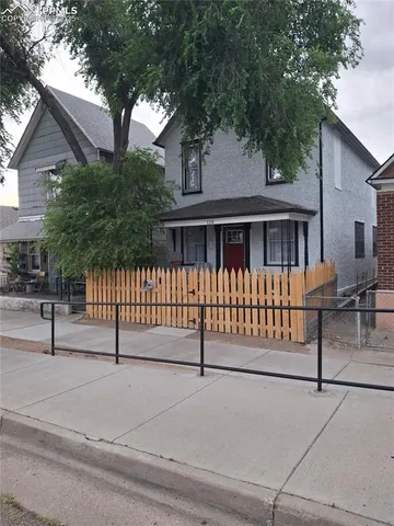 a kitchen with a sink and a refrigerator