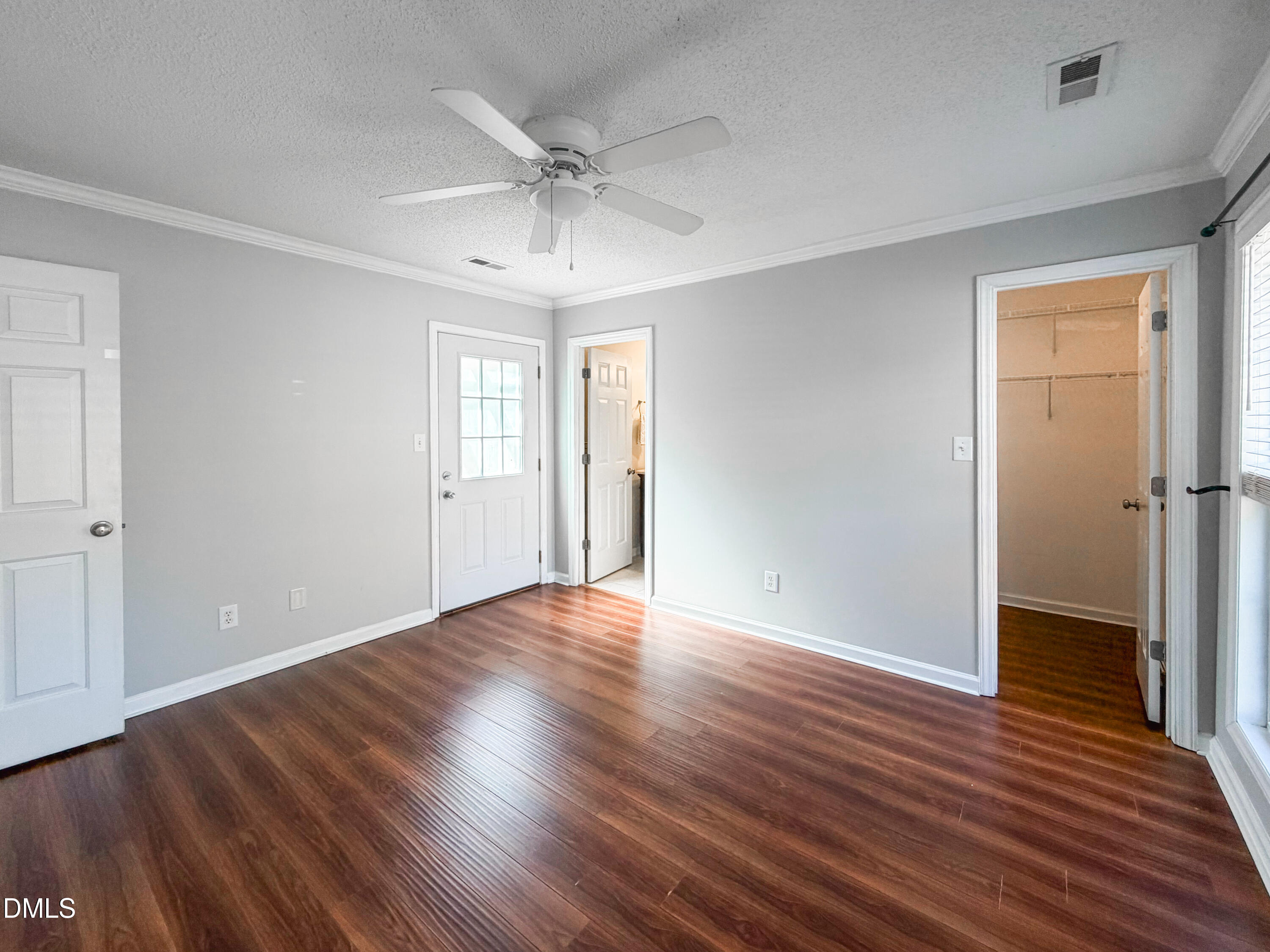 6304 Forest Ridge Drive Durham, NC 27713 - Photo 17 of 29 a view of an empty room with wooden floor and a window