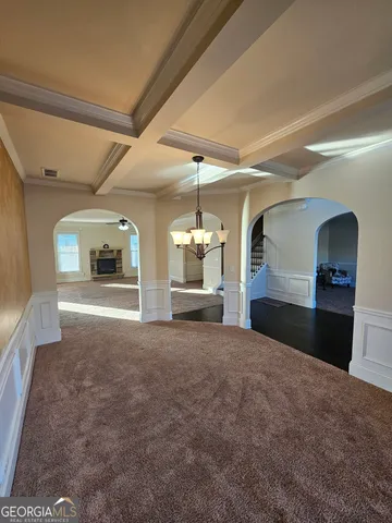 a view of a windows and chandelier in a room