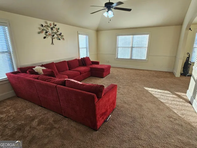 a living room with furniture and a window