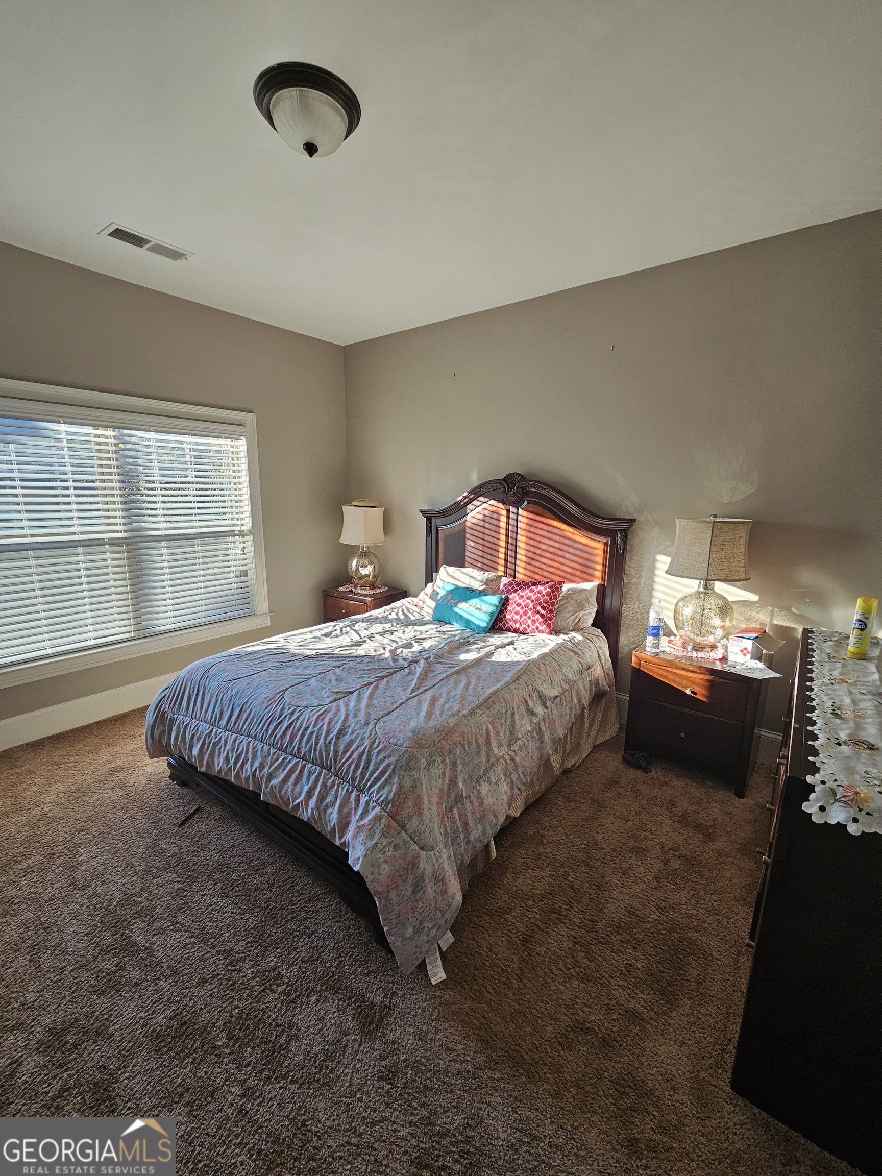 3906 Rosebay Way Southwest Conyers, GA 30094 - Photo 33 of 38 a bedroom with a bed and window