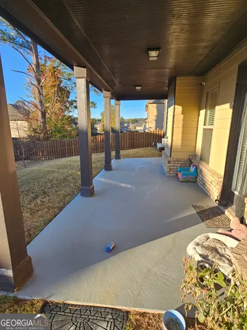 a view of a porch with wooden floor