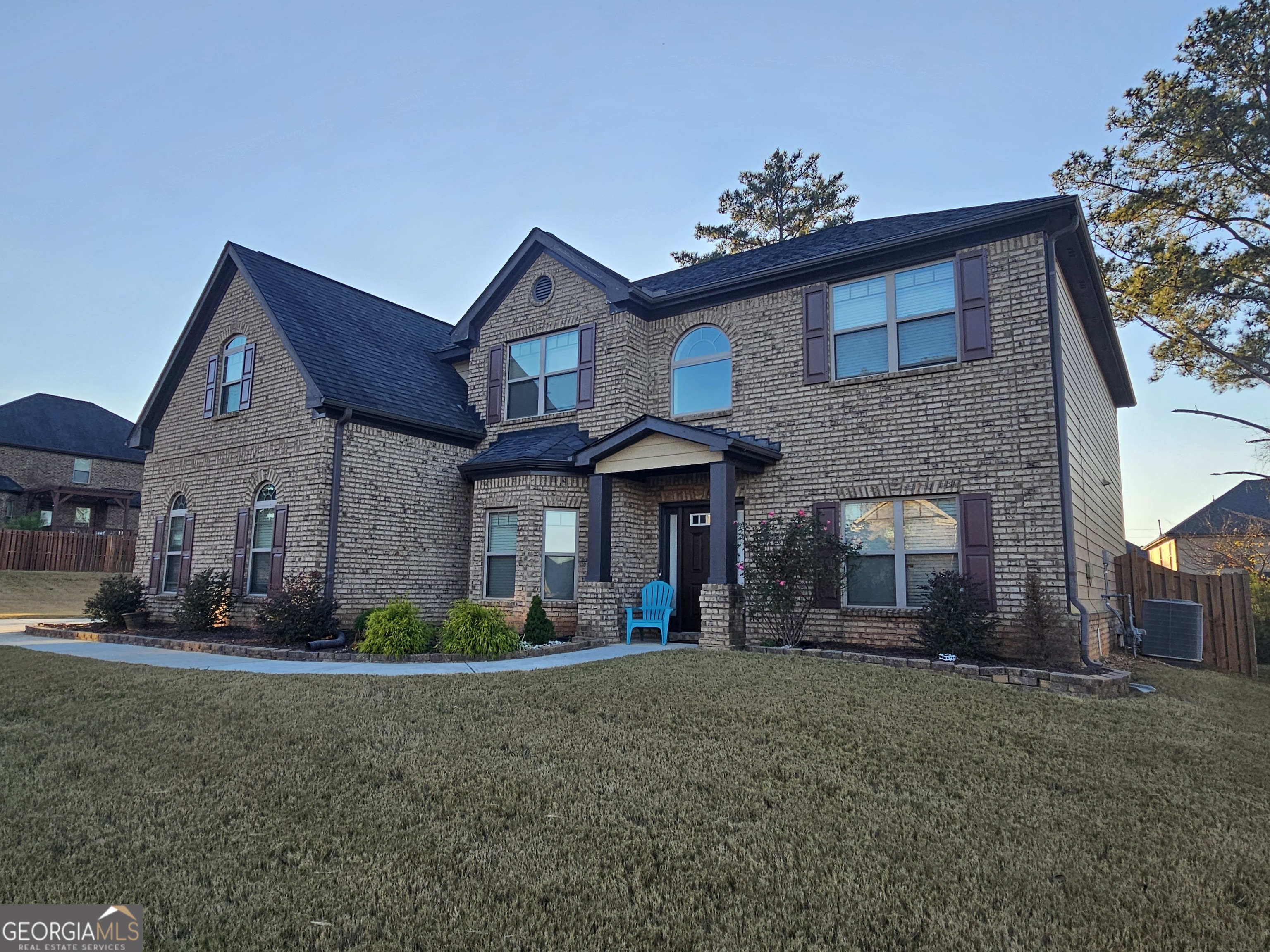3906 Rosebay Way Southwest Conyers, GA 30094 - Photo 4 of 38 a front view of a house with a garden