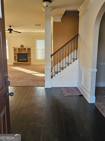 a view of an entryway with wooden floor
