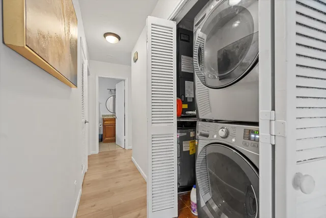 a view of a hallway with washer and dryer