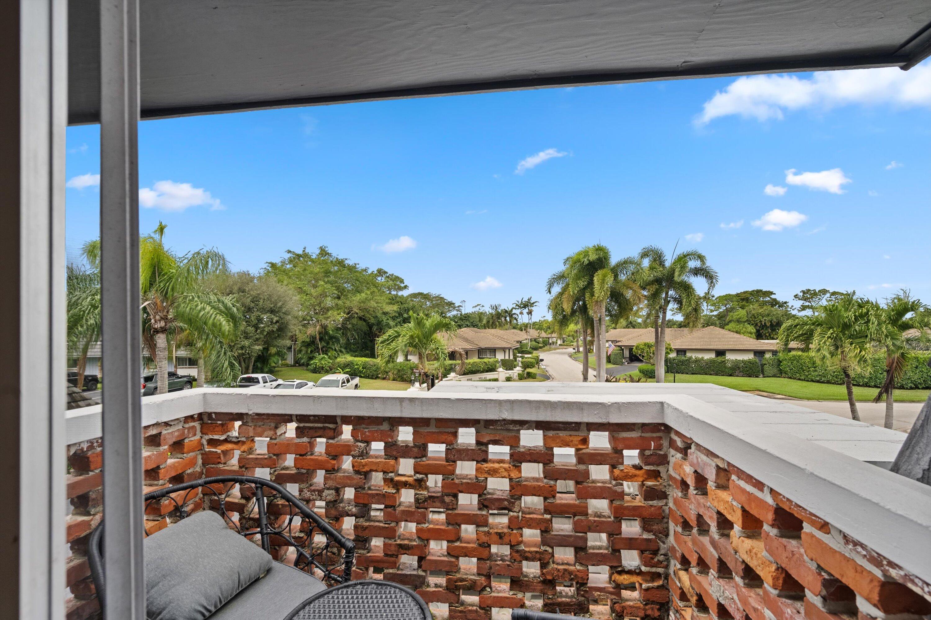 404 Pine Tree Court, Unit 6 Atlantis, FL 33462 - Photo 19 of 26 a view of a black and white checkered floor with a garden view