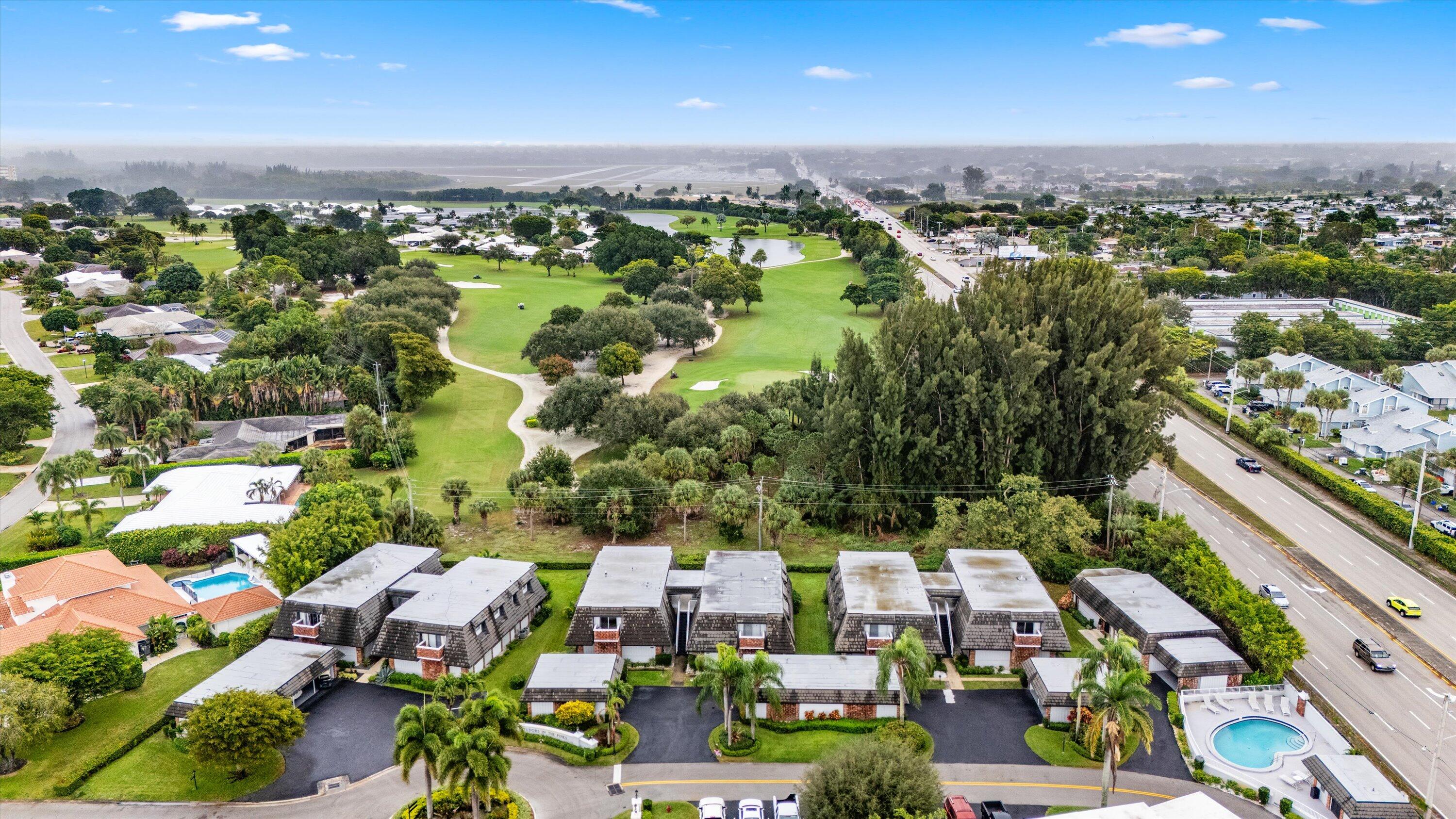404 Pine Tree Court, Unit 6 Atlantis, FL 33462 - Photo 21 of 26 an aerial view of multiple house