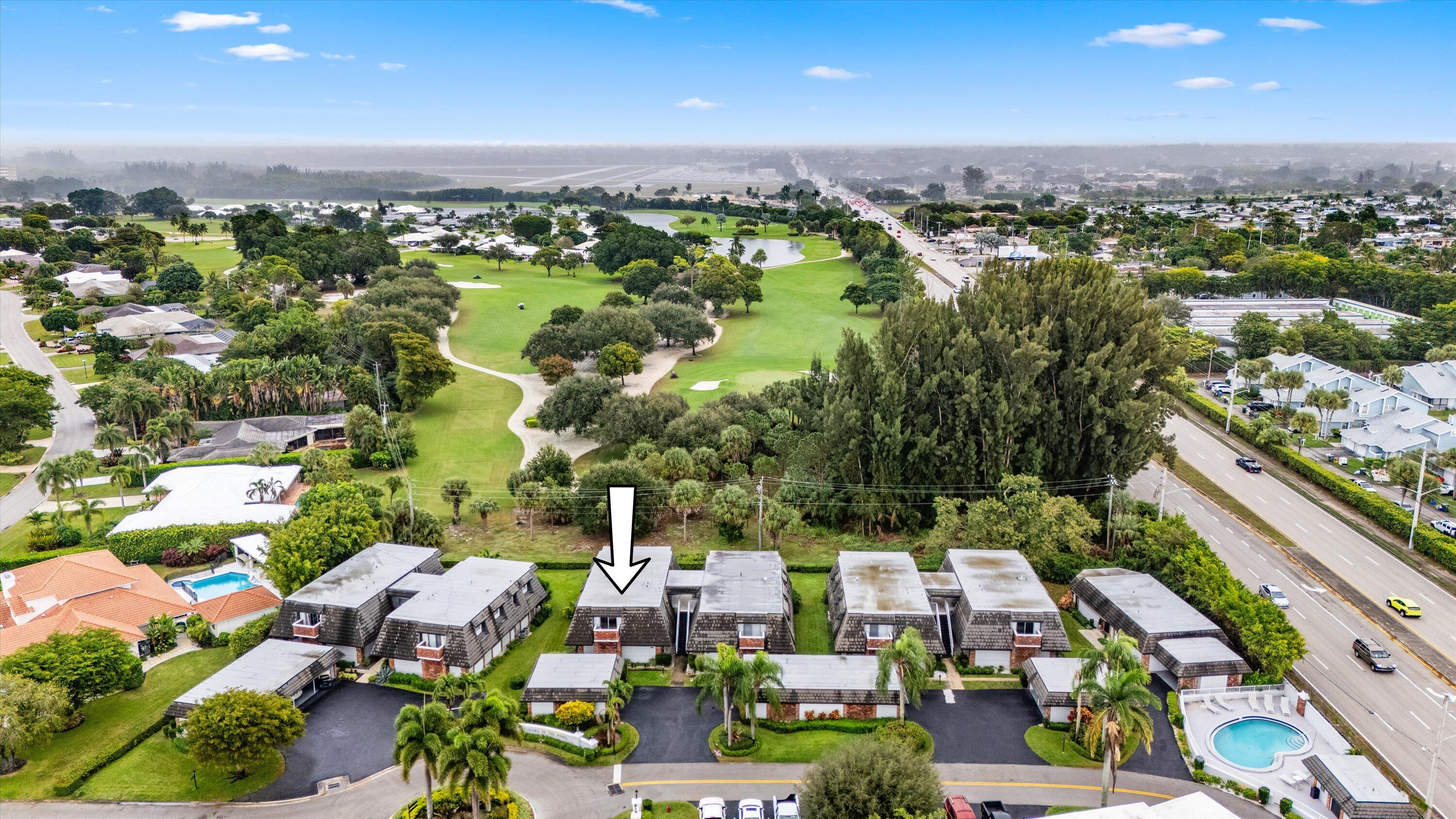 404 Pine Tree Court, Unit 6 Atlantis, FL 33462 - Photo 22 of 26 an aerial view of multiple house