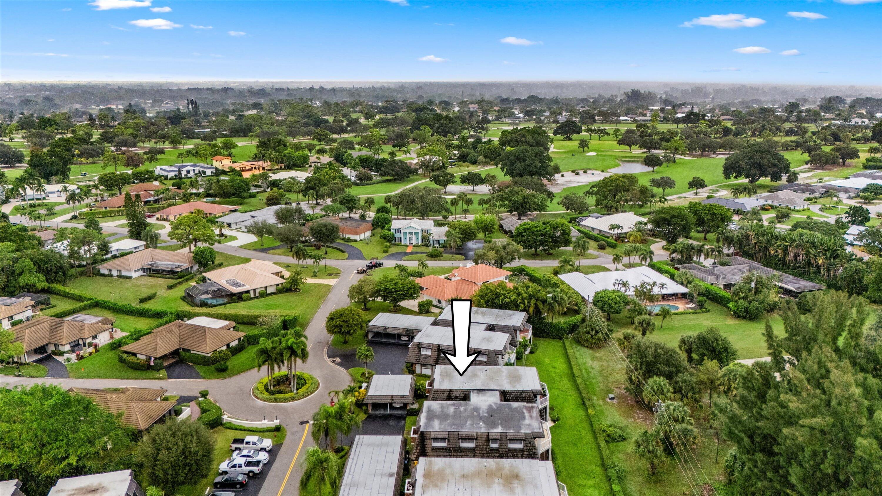 404 Pine Tree Court, Unit 6 Atlantis, FL 33462 - Photo 26 of 26 an aerial view of residential houses with outdoor space