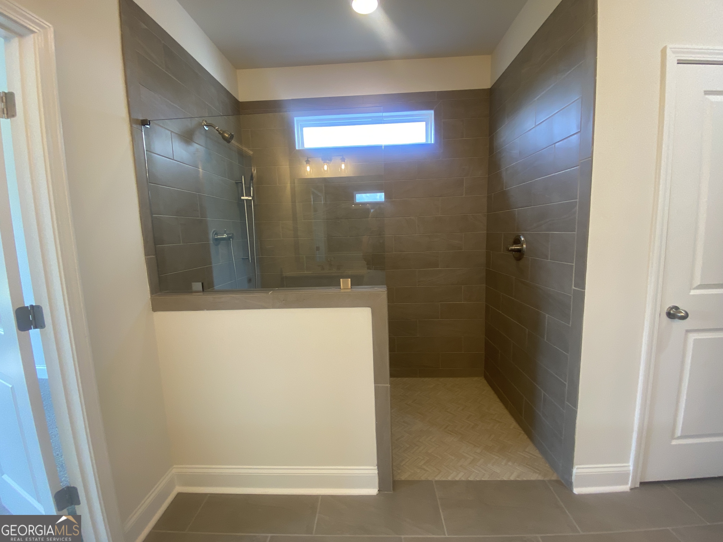 134 Oakdale Road, Unit 31 Jefferson, GA 30549 - Photo 27 of 60 a bathroom with a shower