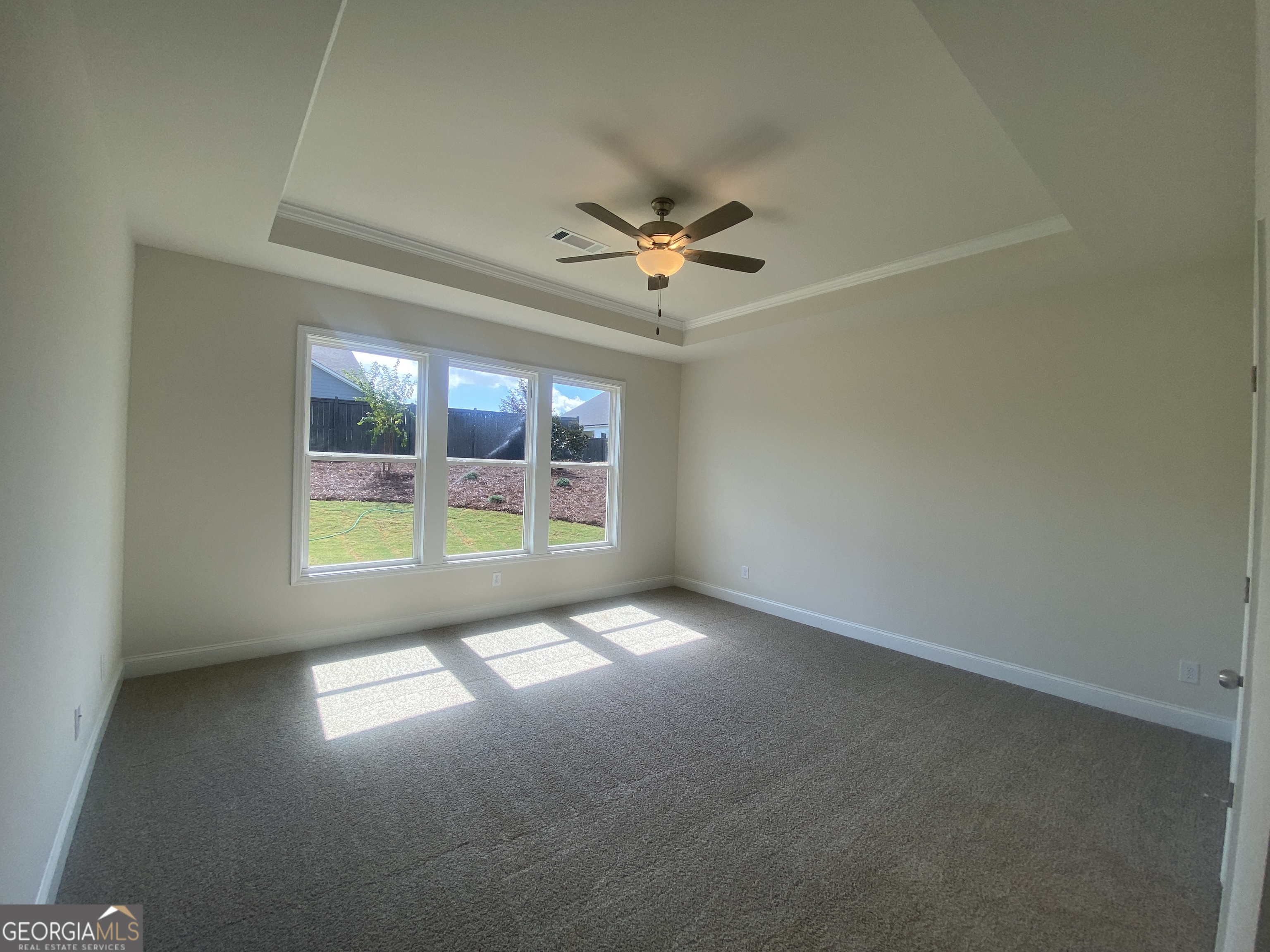 134 Oakdale Road, Unit 31 Jefferson, GA 30549 - Photo 29 of 60 an empty room with windows and fan