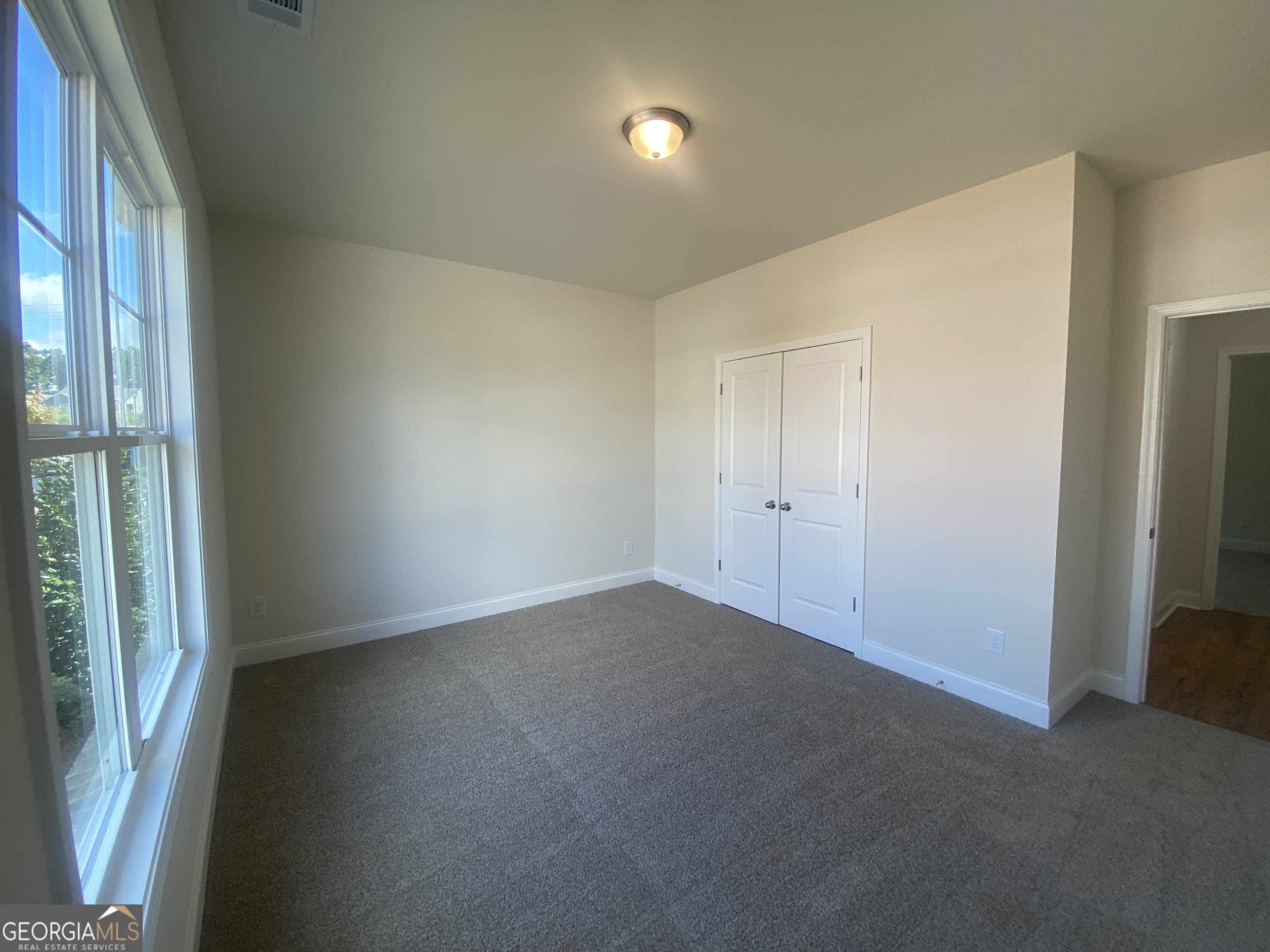 134 Oakdale Road, Unit 31 Jefferson, GA 30549 - Photo 5 of 60 an empty room with windows
