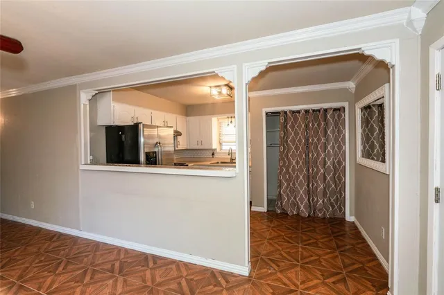 a view of a kitchen from the hallway