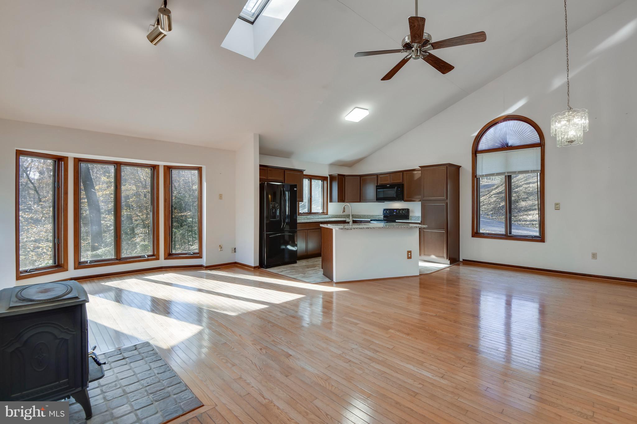460 Farmington Road West Accokeek, MD 20607 - Photo 11 of 34 a view of a kitchen with microwave and wooden floor