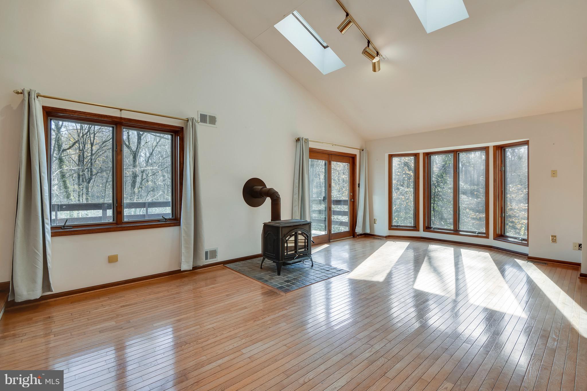 460 Farmington Road West Accokeek, MD 20607 - Photo 17 of 34 a view of an empty room with glass door and wooden floor
