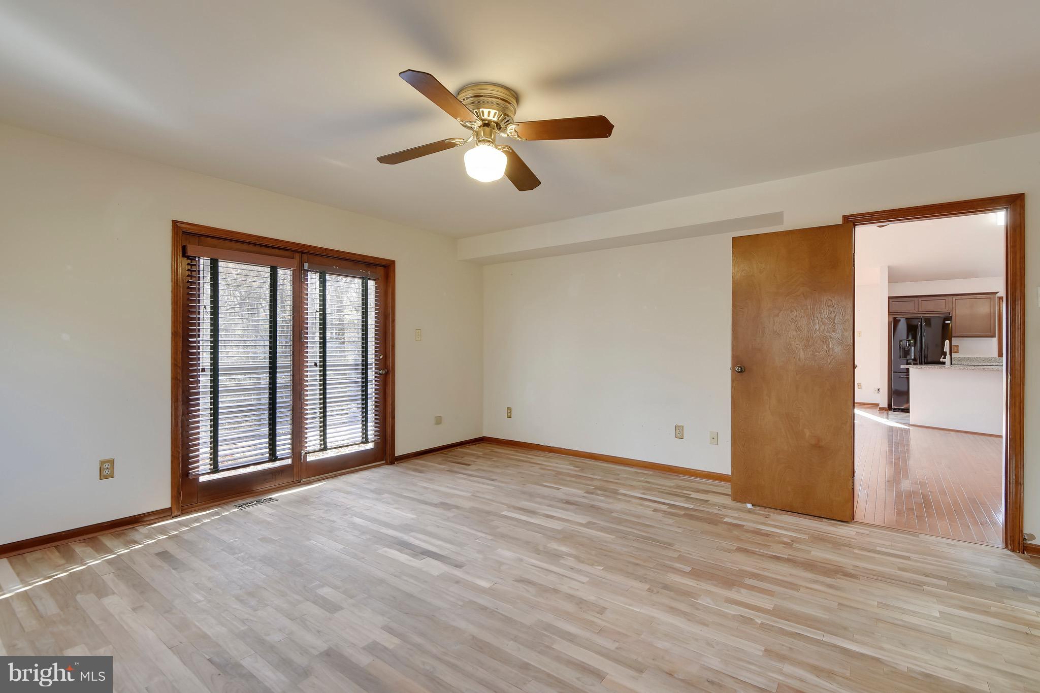460 Farmington Road West Accokeek, MD 20607 - Photo 19 of 34 a view of an empty room with wooden floor and a window