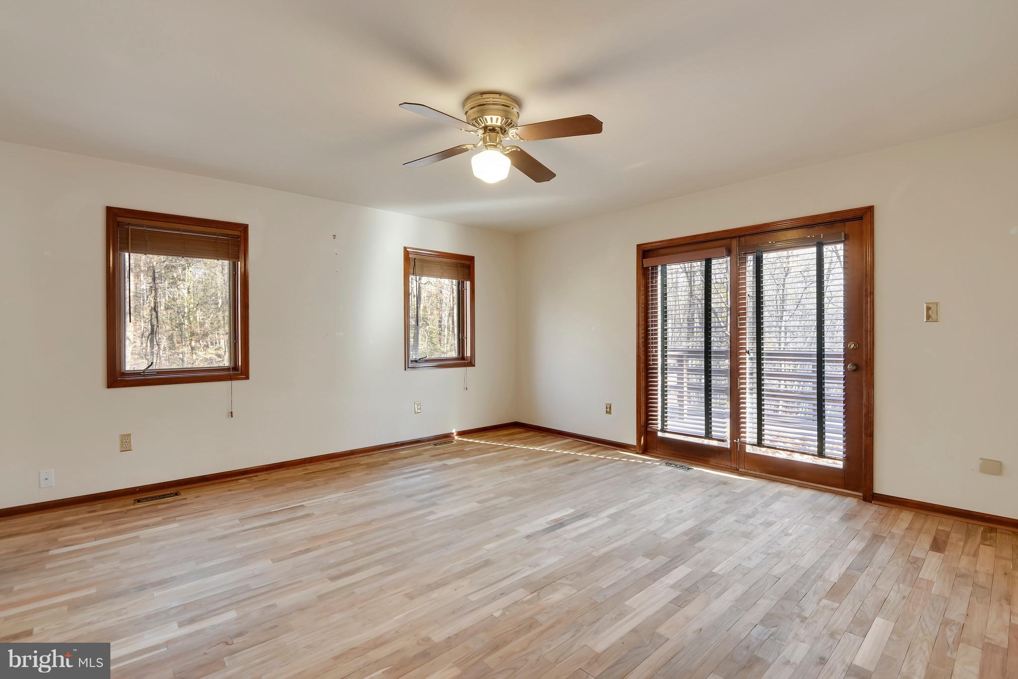 460 Farmington Road West Accokeek, MD 20607 - Photo 20 of 34 a view of an empty room with wooden floor and a window