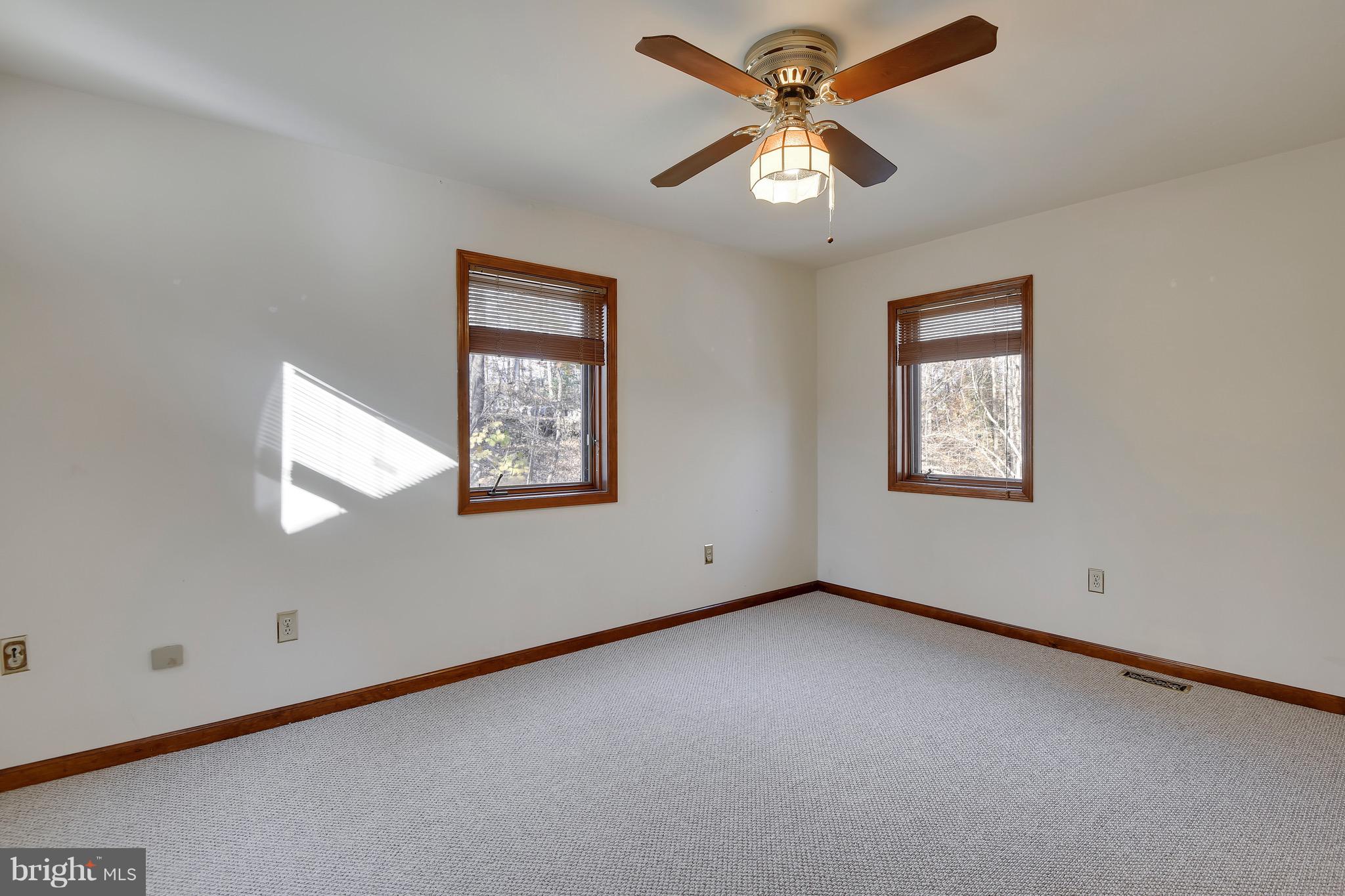 460 Farmington Road West Accokeek, MD 20607 - Photo 27 of 34 an empty room with windows and fan