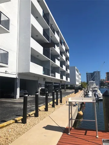 a view of a patio with table and chairs