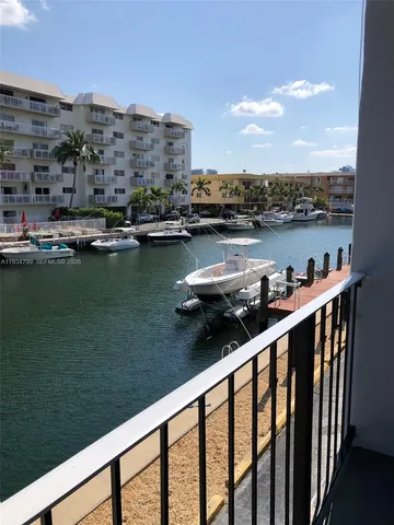 a couple of boats are docked in a balcony