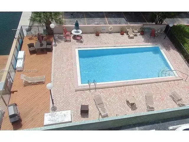 a view of living room with furniture and flat screen tv