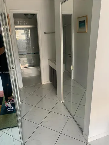 a bathroom with a vanity and a shower