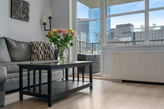 a view of a chairs and table in the balcony