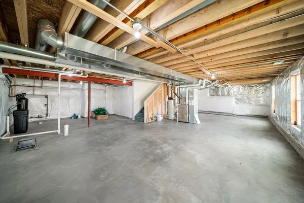 a view of empty room with wooden ceiling