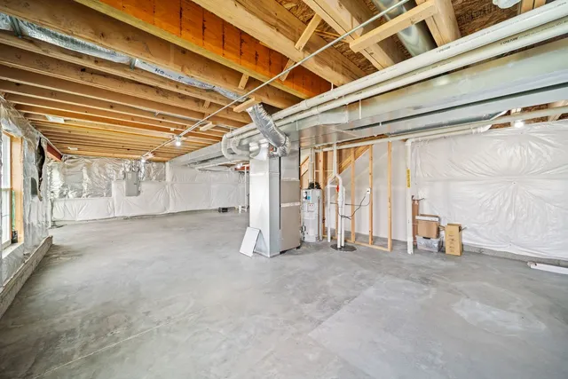 a view of empty room with wooden walls