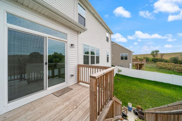 a view of a house with backyard and porch