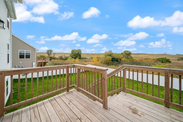 a view of a balcony with wooden floor