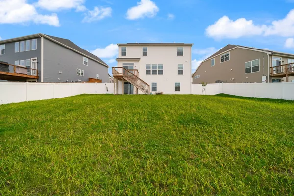 a view of a back yard of the house