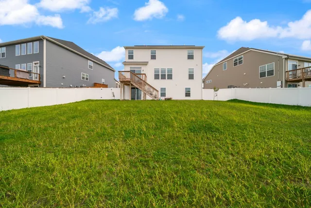 a view of a back yard of the house