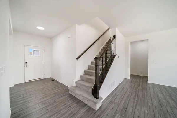 a view of entryway with wooden floor