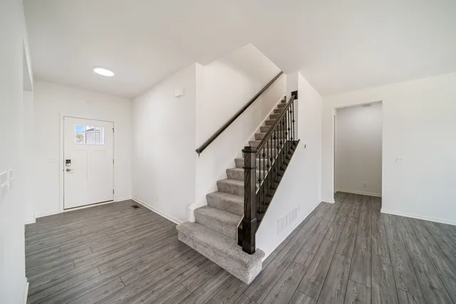 a view of entryway with wooden floor