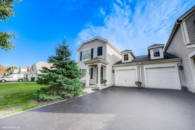 a view of a house with a yard