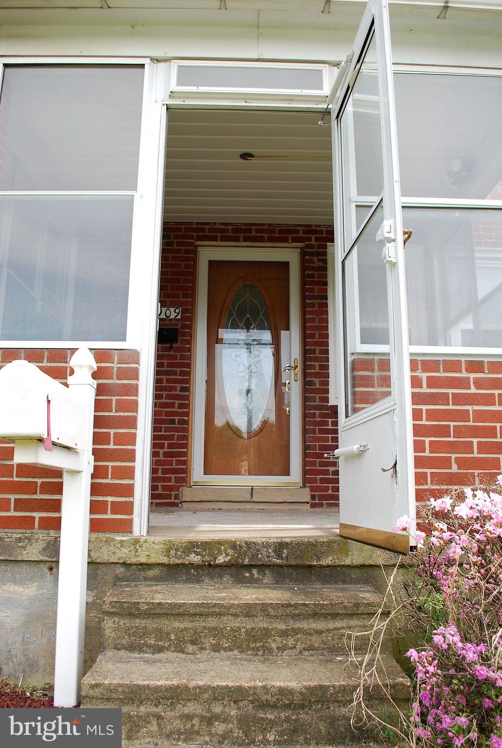 6909 Broening Road Baltimore, MD 21222 - Photo 4 of 13 Enter the enclosed front porch