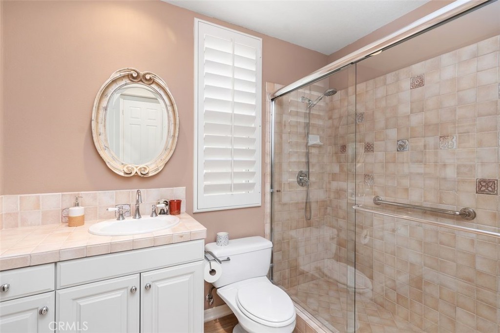 354 Salta Verde Point Long Beach, CA 90803 - Photo 20 of 33 a bathroom with a granite countertop sink mirror vanity and toilet